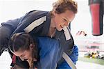 Women practicing judo in gym