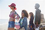 Multi-ethnic family standing on sunny summer beach