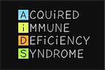 AIDS acronym Acquired Immune Deficiency Syndrome handwritten with white chalk on blackboard.