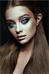 Fashion model Woman with fantasy make up. Long blowing brown hair. Fantasy Girl. Mermaid.