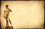 Grunge background with paper texture and statue of Michelangelo's David. Copy space for your text