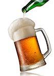 Beer pouring into mug isolated on a white background