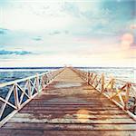 Pier on the sea at sunset. Freedom and relax concept