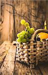 Fresh grapes on wood. Autumn fruit