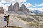 Hicker admire the Three Peaks of Lavaredo. Sesto Dolomites, Trentino Alto Adige, Italy, Europe