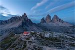Europe, Italy, Dolomites, South Tyrol, Bolzano. Paterno, Tre Cime di Lavaredo and the Locatelli hut at dawn.