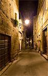 Street of the historic center at night. Pitigliano, Grosseto province, Tuscany, Italy, Europe