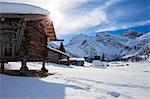 Walser houses and the white typical church of Sertig Dorfli. Sertigtal, Graubuenden(Canton Grigioni),Prattigau(Prattigovia)/Davos, Switzerland, Europe