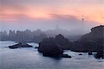 Ouessant island, Brittany, France. The Creach lighthouse into the fog at sunrise.