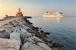 Europe, Italy, Veneto, Venice, Cavallino coast. Cruise ship passing near the lighthouse of Punta Sabbioni