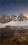 Pale di San Martino, Dolomites, Italy. An alpin lake it's reflecting the famous Pale di San Martino ridges, under the stars.