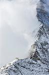 Hornli-hutte covered in the fog that hides the peak of the Matterhorn. Zermatt, Valais, Switzerland Europe