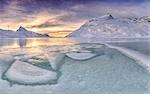 Sunrise lights the frozens surface ok White Lake at Bernina Pass. Canton of Graubuenden. Engadine. Switzerland. Europe