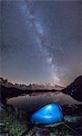 Camping under the stars at Lac de Cheserys. In the background the range of Mont Blanc. Haute Savoie. France