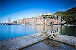 The blue sea at dusk frames the typical colored houses of Portovenere La Spezia province Liguria Italy Europe