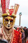 Colorful mask and costume of Carnival of Venice famous festival worldwide Veneto Italy Europe