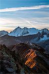 The sunrise lights painting the elegant profiles of the Tonale mount Tonale mount, Lombardy, Italy.Europe