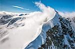 The sinuous shape of the Biancograt at the Piz Bernina, one of the most famous peaks of the Alps (4050 m.) - Bernina Engadin, Canton Graubuenden, Switzerland Europe