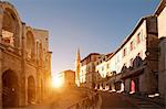 View of street and Arles Amphitheatre, Arles, Provence-Alpes-Cote d'Azur, France