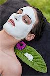 Woman in spa environment, wearing face mask