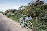 Bicycle parked on coastal path, Veere, Zeeland, Netherlands