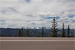Squaw Pass highway and distant mountains, Evergreen, Colorado, USA