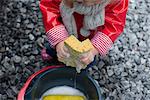 Child holding soapy sponge