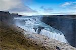 Landscape with waterfall and steam. Gullfoss, Southwest Iceland, Europe.