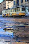 The yellow tram in the typical streets of the old town Milan Lombardy Italy Europe