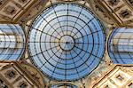 View of the glass dome and artistic decorations of the historical Galleria Vittorio Emanuele II Lombardy Italy Europe