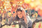 Europe,Italy,Umbria,Perugia district,Montefalco. Child playing in a vineyard.