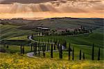 Europe, Italy, Baccoleno farmhouse at sunset, Crete Senesi, province of Siena.