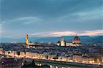 The blue light of dusk frames the city of Florence crossed by Arno River seen from Piazzale Michelangelo Tuscany Italy Europe