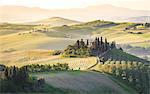 Podere Belvedere, the famous italian farmhouse, during sunrise. Val d'Orcia, Siena province, Tuscany, Italy