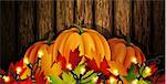 The vector illustration of pumpkins isolated on wooden background, maple leafs. It is autumn. It is Thanksgiving day