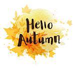 Abstract autumn background with orange falling maple leaves. "Hello autumn" lettering and yellow watercolor blots.