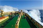 Bow of the icebreaker cruise ship, Kapitan Khlebnikov, on the way to Ushuaia, Argnetina with waves crashing from the rough seas of the Drake Passage in the Southern Atlantic Ocean between South America and Antartica