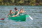 Family practising in a canoe, Esparron lake, Esparron de Verdon, Alpes de Haute Provence, France, Europe