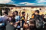 Selfie takers at the Garganta del Diablo (Devil's Throat), Iguazu Falls, UNESCO World Heritage Site, Iguazu, Argentina, South America