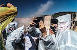 Selfie takers in plastic, Garganta del Diablo (Devil's Throat), Iguazu Falls, UNESCO World Heritage Site, Iguazu, Brazil, South America