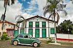 Colonial architecture in the old town with iconic VW Beetle car, Pirenopolis, Goias state, Brazil, South America