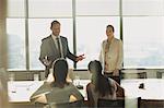 Businessman talking in conference room meeting