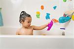 Little boy in bath tub at bath time