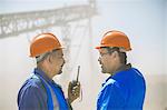 Two quarry workers in discussion, at quarry