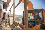 Quarry worker, in quarry, operating heavy machinery