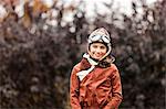 Portrait of girl wearing pilot costume for halloween in park