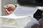 Cropped view of businessman reading contract