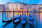 Europe, Italy, Veneto, Venice Gondolas moored in the Grand Canal at sunset.