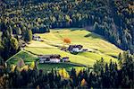 Autumnal scenery with mountain lodges and trees . Santa Maddalena, Funes, Bolzano, Trentino Alto Adige - Sudtirol, Italy, Europe.
