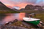 Trollstigen, Norway. Sunset with boat near the Troll Road.